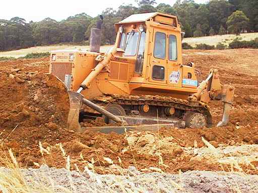 Dozer pushing clay.